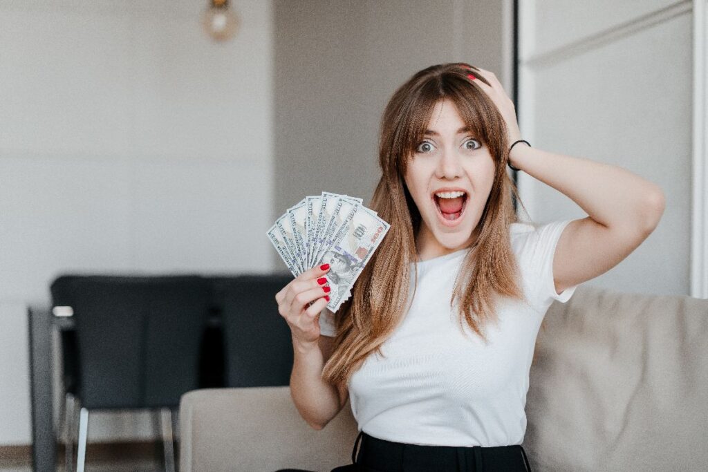 Couponing With Ibotta - A woman overwhelmed with joy from earning cash back through bonuses.